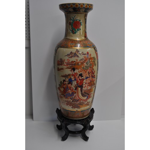 32 - Japanese Imari style urn vase with family scenes and colourful flora approx. 60cm tall, on stand