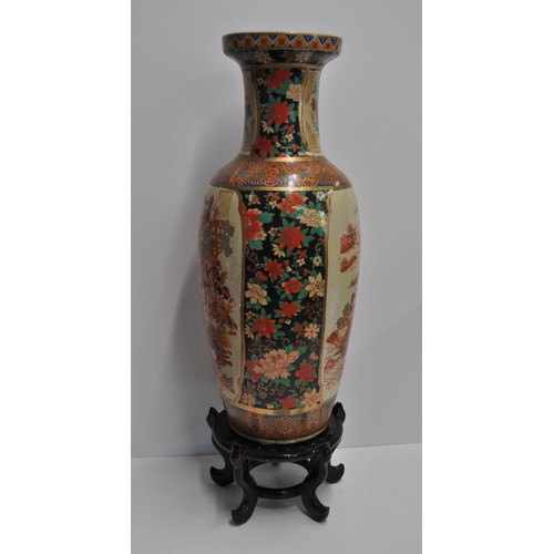 32 - Japanese Imari style urn vase with family scenes and colourful flora approx. 60cm tall, on stand