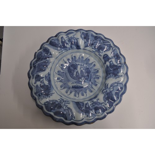 44 - A pair of antique faience blue and white Chinese style chargers, approx. diameter 35cm AF