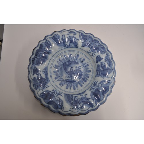 44 - A pair of antique faience blue and white Chinese style chargers, approx. diameter 35cm AF