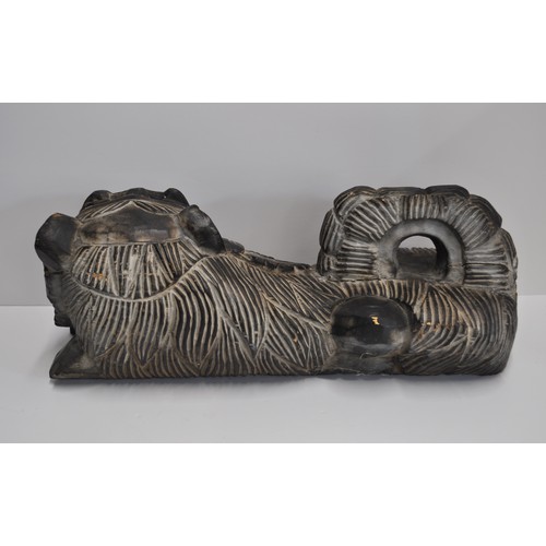 47 - Oriental hand-carved foo dog in laying stance, approx. size L 50cm X H 20cm A/F