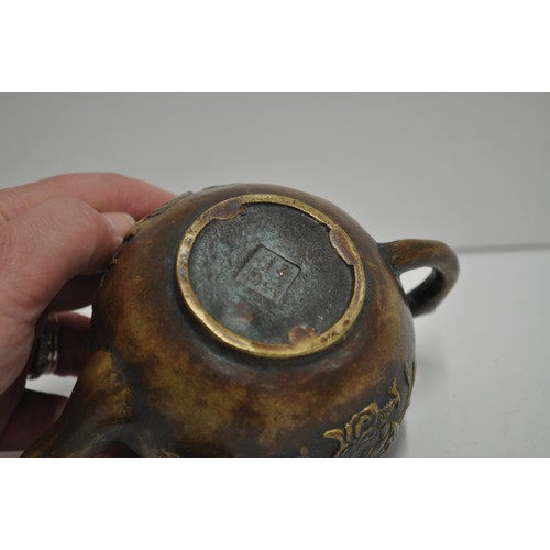 61 - Chinese small teapot with a scene depicting a man on dragon, stamp to base.  approx. H 9cm X W 13cm