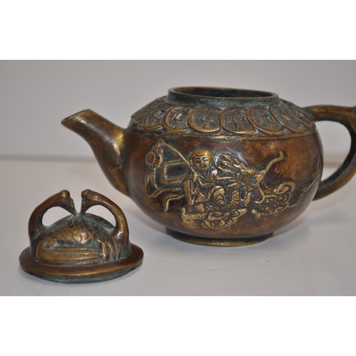 61 - Chinese small teapot with a scene depicting a man on dragon, stamp to base.  approx. H 9cm X W 13cm