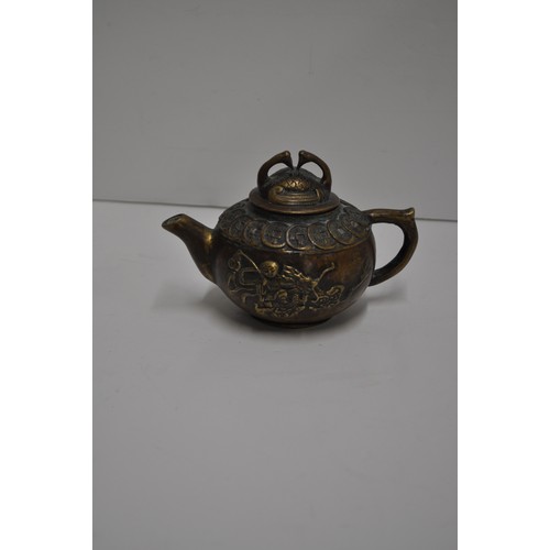 61 - Chinese small teapot with a scene depicting a man on dragon, stamp to base.  approx. H 9cm X W 13cm