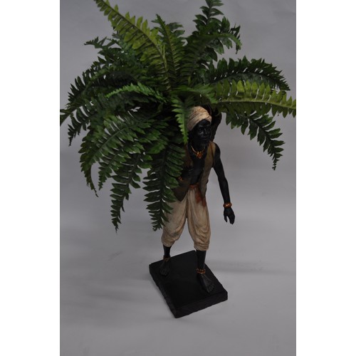 62 - African figure depicting man carrying fruit basket approx. H61cm