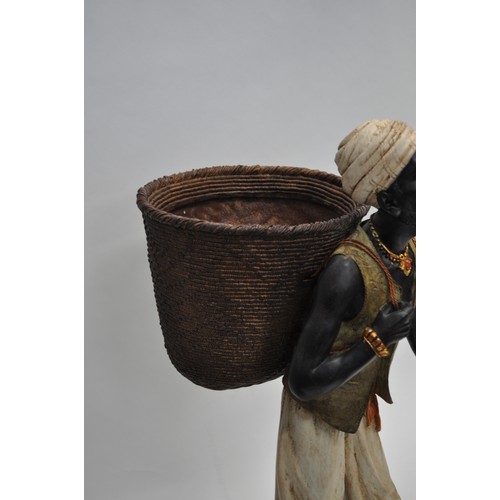 62 - African figure depicting man carrying fruit basket approx. H61cm