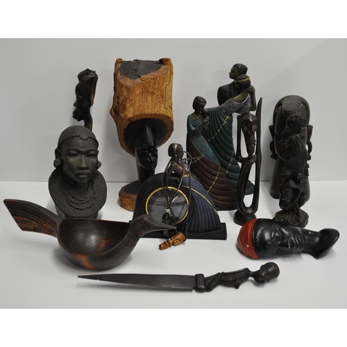 63 - A group of predominantly African style figures and busts. Made from materials of wood, resin, and me... 