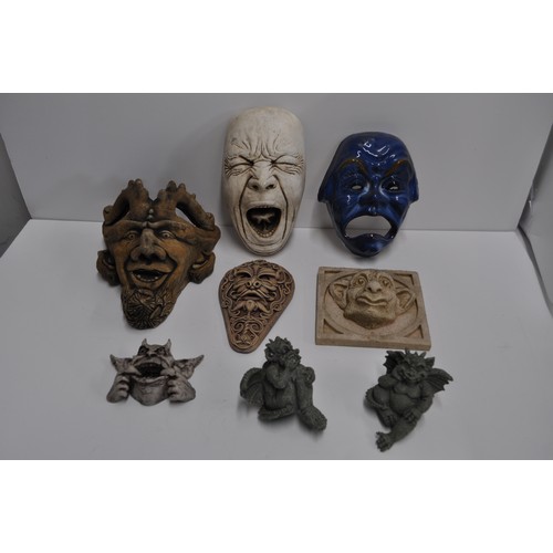 69 - A group of wall plaques, masks to include gargoyles, horned devil and oriental designs etc