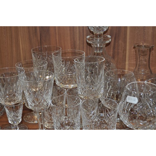 74 - Large quantity of various cut crystal glassware items, including Doulton and Waterford crystal bowls... 