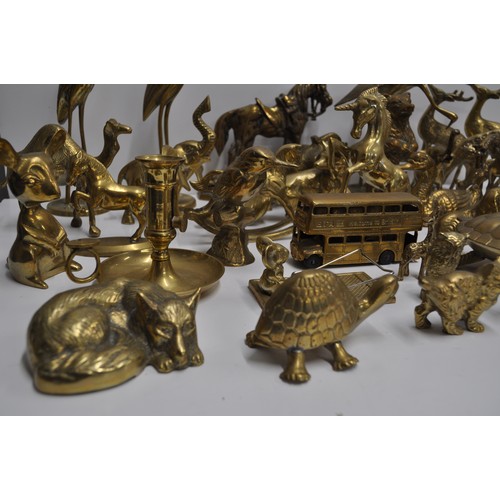 80 - A large quantity of brass and metalware items in various shapes and designs to include candlestick h... 