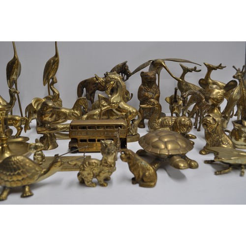 80 - A large quantity of brass and metalware items in various shapes and designs to include candlestick h... 