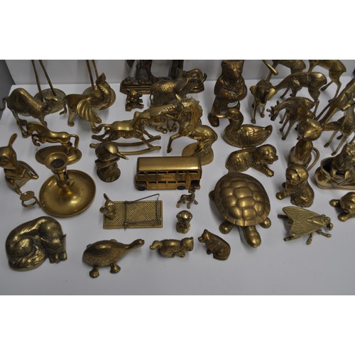 80 - A large quantity of brass and metalware items in various shapes and designs to include candlestick h... 