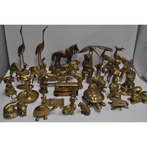 80 - A large quantity of brass and metalware items in various shapes and designs to include candlestick h... 