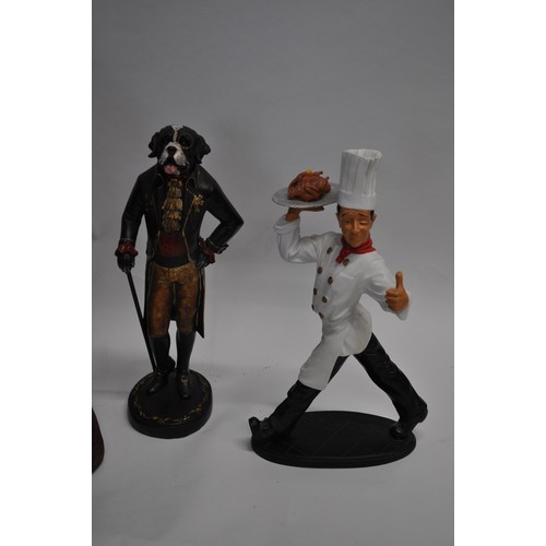 87 - Butler serving statue overall approx. H65cm, together with a quirky chef figure and a gentleman dog ... 