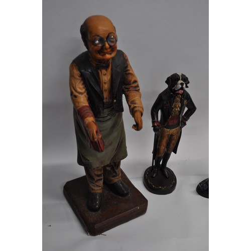 87 - Butler serving statue overall approx. H65cm, together with a quirky chef figure and a gentleman dog ... 