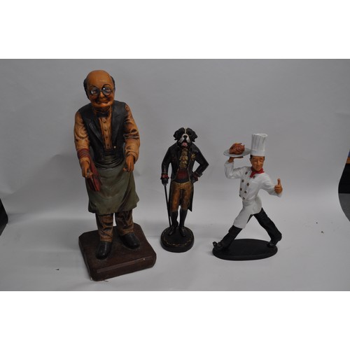 87 - Butler serving statue overall approx. H65cm, together with a quirky chef figure and a gentleman dog ... 