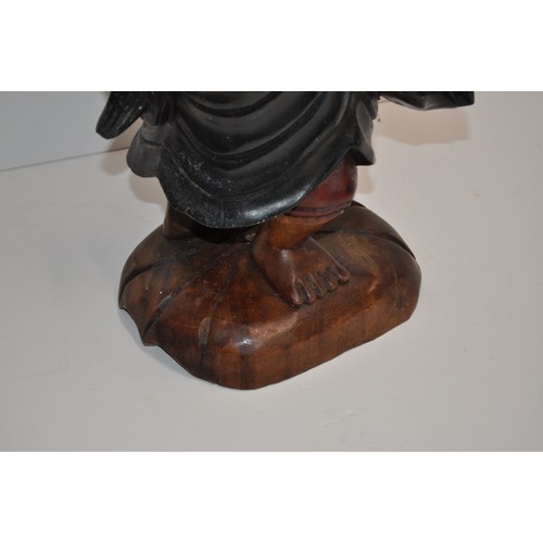 111 - Carved wooden statue of Chinese fisherman returning with his catch, approx. H 53cm