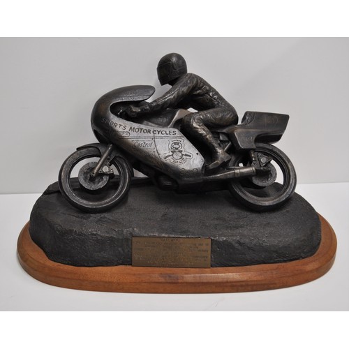 115 - Hailwood commemorative bronzed style model - Mike Hailwood depicted thundering out of Governors Brid... 