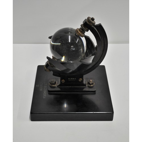 124 - 'Rare' Negretti and Zambra sunshine recorder with glass sphere in black metal mounts on a slate base... 