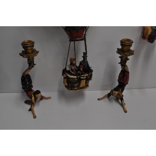 129 - A pair of acrobat candlesticks together with other comical clown figure items