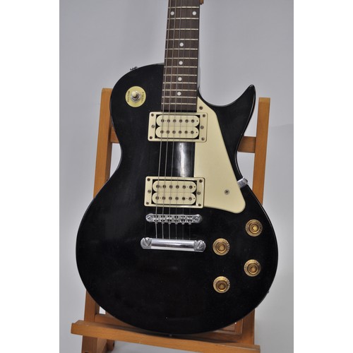 133 - Encore 6 string electric guitar in the Les Paul shape design (stand excluded)