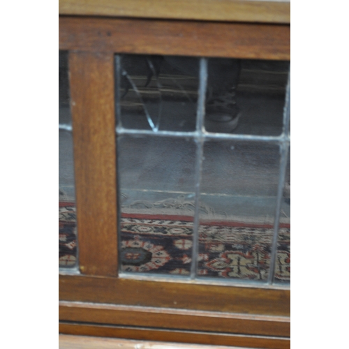 139 - Three-section bookcase with up and over leaded glass fronts, can be disassembled for easy transport,... 