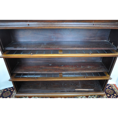 139 - Three-section bookcase with up and over leaded glass fronts, can be disassembled for easy transport,... 