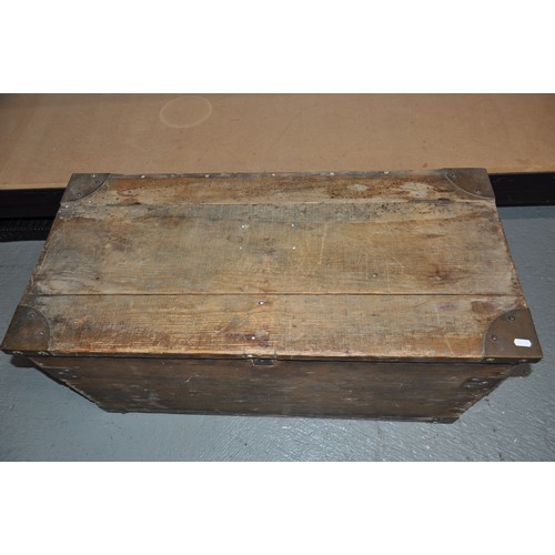 141 - Distressed wooden trunk with metal fixings, hinged lid to top. Approx size L 94 x H 47 D44cm