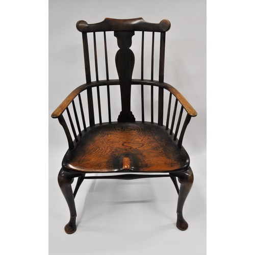 143 - 18th century comb-back Windsor chair. The central column-shaped splat flanked by spindles over a mou... 