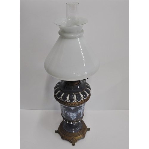 155 - Vintage ceramic oil lamp, decorated with floral pattern, complete with glass shade and funnel