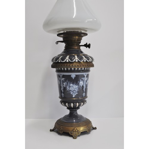 155 - Vintage ceramic oil lamp, decorated with floral pattern, complete with glass shade and funnel