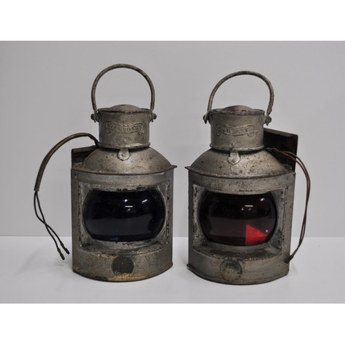 159 - A pair of galvanised ships mast head port and starboard lamps stamped and marked by O.M.Watts LTD