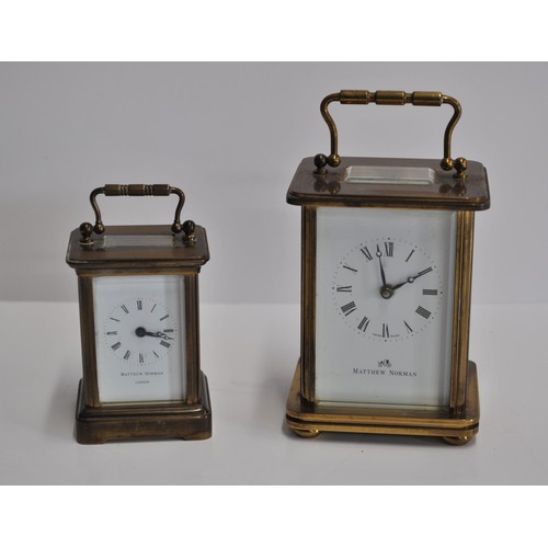 163 - x2 Matthew Norman brass carriage clocks of varying size, engraved '11 jewels' with a bevelled glass ... 