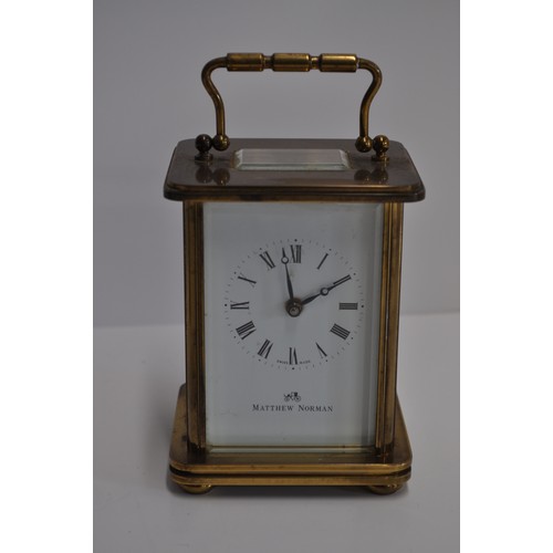 163 - x2 Matthew Norman brass carriage clocks of varying size, engraved '11 jewels' with a bevelled glass ... 