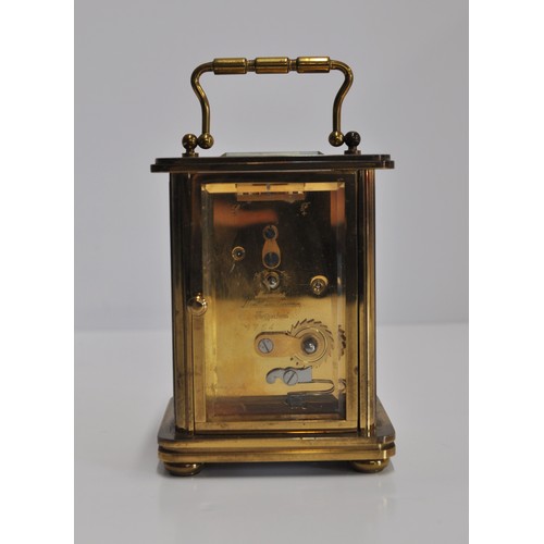 163 - x2 Matthew Norman brass carriage clocks of varying size, engraved '11 jewels' with a bevelled glass ... 