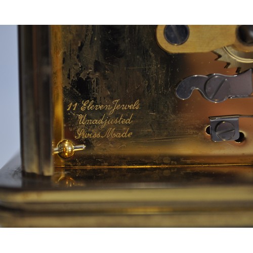 163 - x2 Matthew Norman brass carriage clocks of varying size, engraved '11 jewels' with a bevelled glass ... 