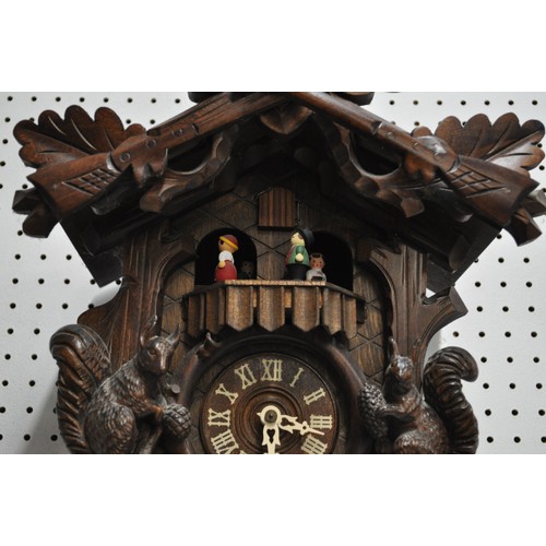 178 - Swiss Cuckoo Clock with stag head and black forest design, complete with weights, untested