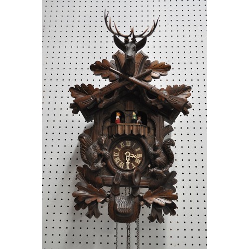 178 - Swiss Cuckoo Clock with stag head and black forest design, complete with weights, untested