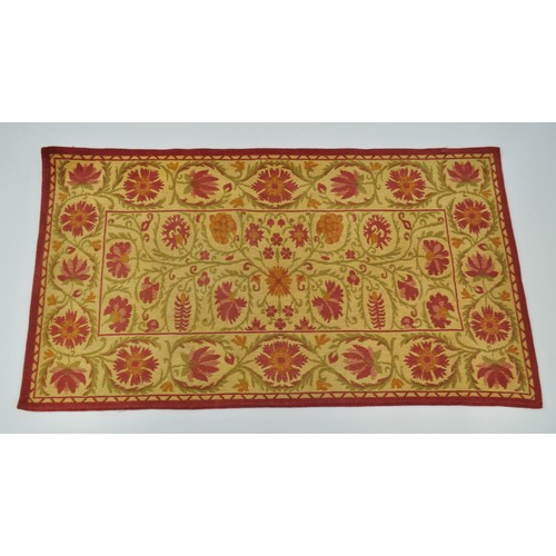 184 - Garin Rug in floral designs, red, green and beige. Approx size 122cm x 66cm