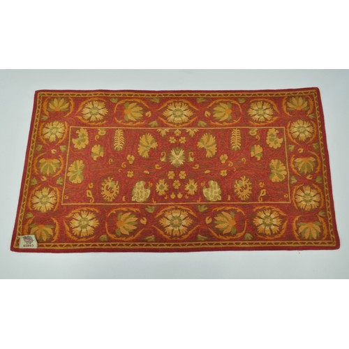 184 - Garin Rug in floral designs, red, green and beige. Approx size 122cm x 66cm