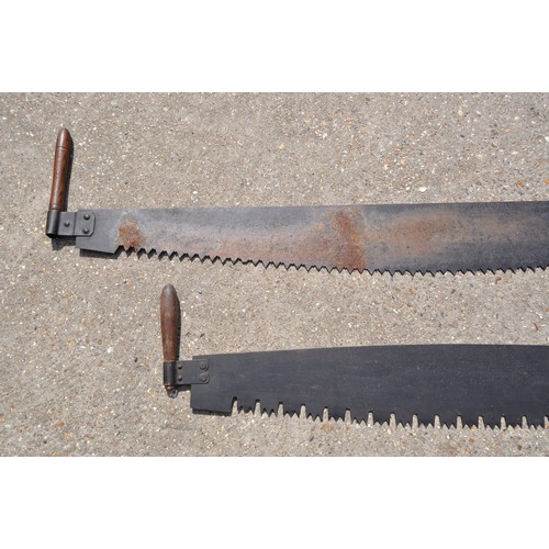 187 - A pair of antique double handled cross cut saws, different length approx. overall length including h... 