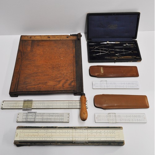 188 - A group of measuring instruments to include Faber Castell. Rolls Royce Blundell omega slide rule X2,... 