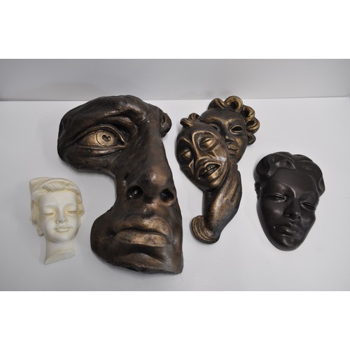 212 - A group of wall plaques - Consisting f a David Michael Angelo's face in a bronze style together with... 