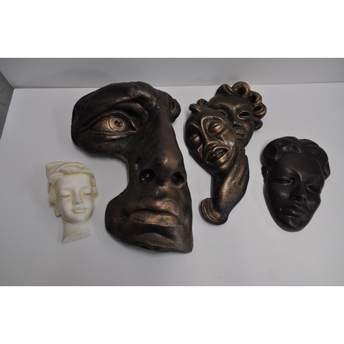 212 - A group of wall plaques - Consisting f a David Michael Angelo's face in a bronze style together with... 