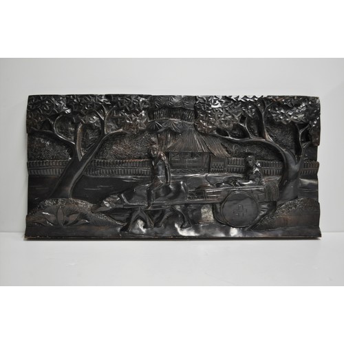 216 - Hardwood carved panel depicting a rural scene of a bullock cart