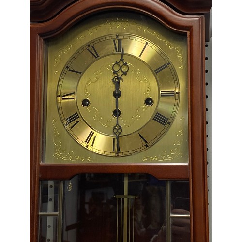 176 - Cased wall clock with brass coloured dial and roman numerals, includes original purchase receipt fro... 