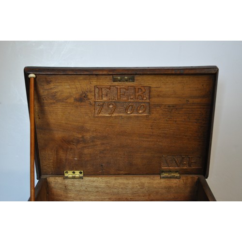 11 - A vintage sewing box with EER 1900 carved into the inside lid together with sewing and knitting mate... 