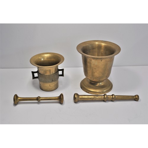 41 - x2 mortar and pestles, one believed to be made out of a brass shell casing. Approx height of tallest... 