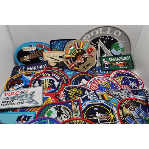 54 - A collection of 58 sorted cloth/embroidered NASA and space-related badges, including Apollo, Pegasus... 