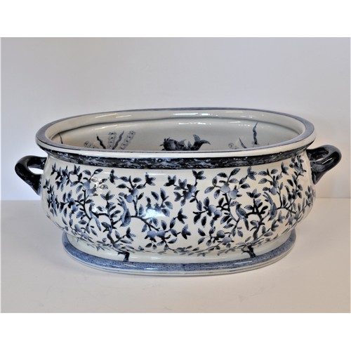 73 - A large Ironstone China oval ceramic twin handled planter / bowl  with  hand painted designs of Koi ... 